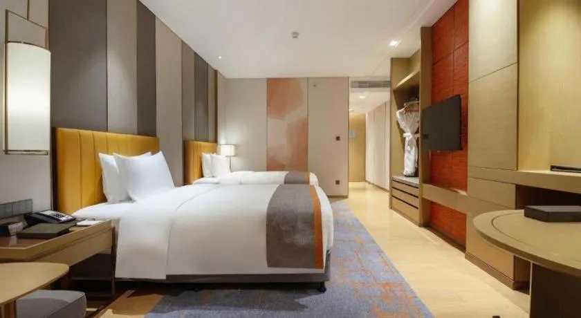 Bed in Hui Feng Wan Yun Hotel Hefei