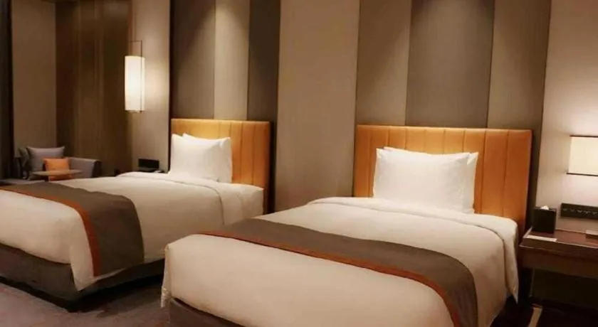 Bed in Hui Feng Wan Yun Hotel Hefei