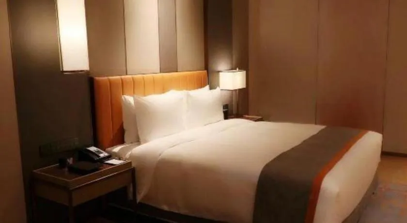 Bed in Hui Feng Wan Yun Hotel Hefei