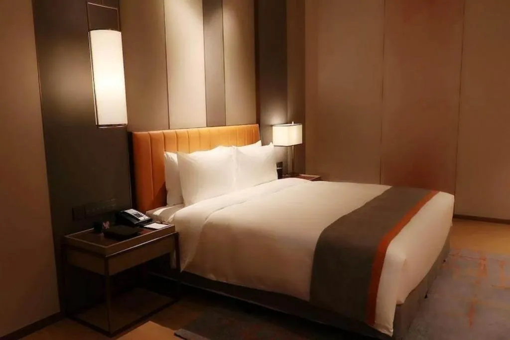 Bed in Hui Feng Wan Yun Hotel Hefei