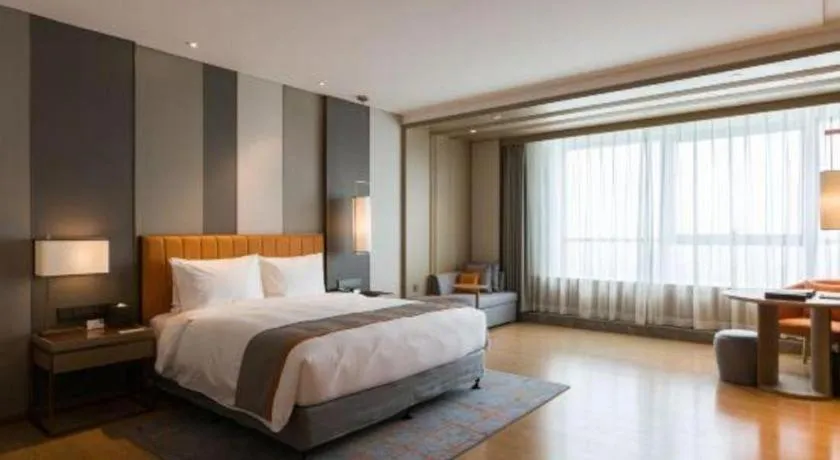 Bed in Hui Feng Wan Yun Hotel Hefei