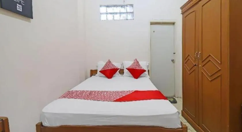 Bed in OYO 2899 Ardilia Bandara Syariah