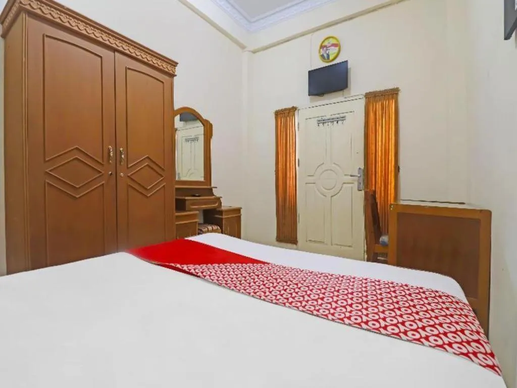 Bed in OYO 2899 Ardilia Bandara Syariah