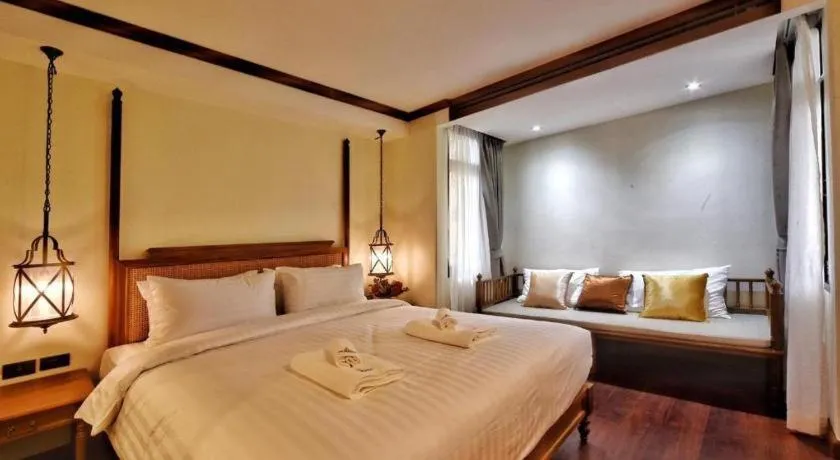 Bed in De Manor Chiang Mai Hotel