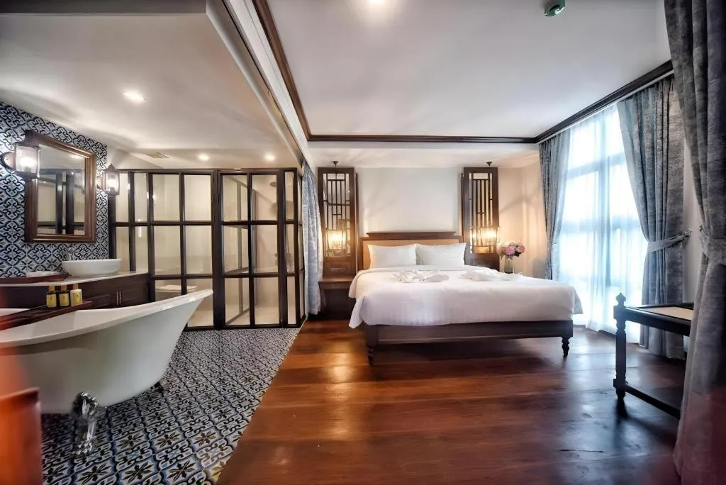 Bed in De Manor Chiang Mai Hotel