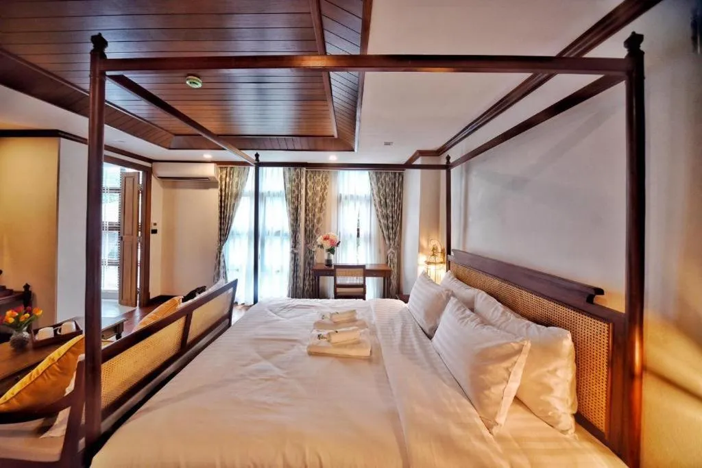 Bed in De Manor Chiang Mai Hotel