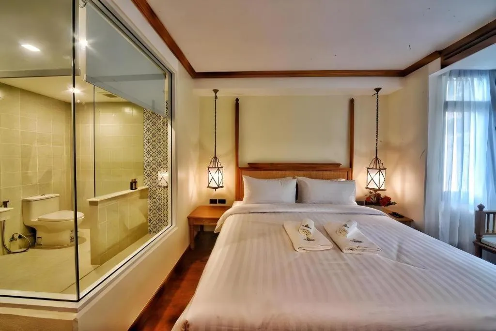 Bed in De Manor Chiang Mai Hotel