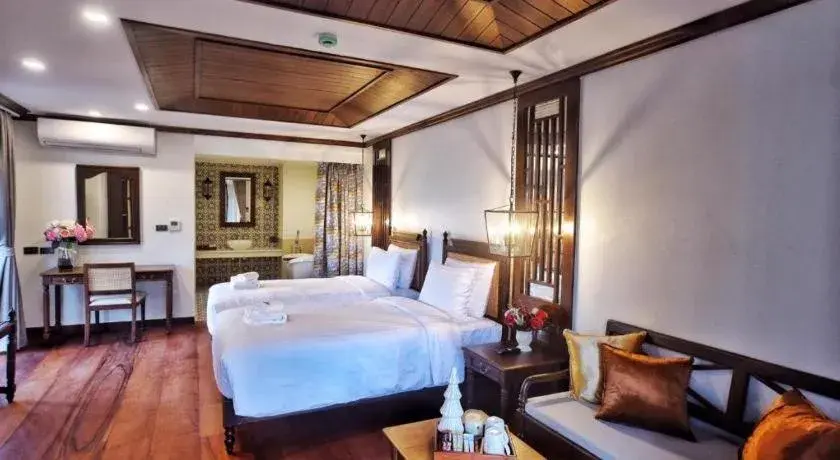 Bed in De Manor Chiang Mai Hotel Bed in De Manor Chiang Mai Hotel