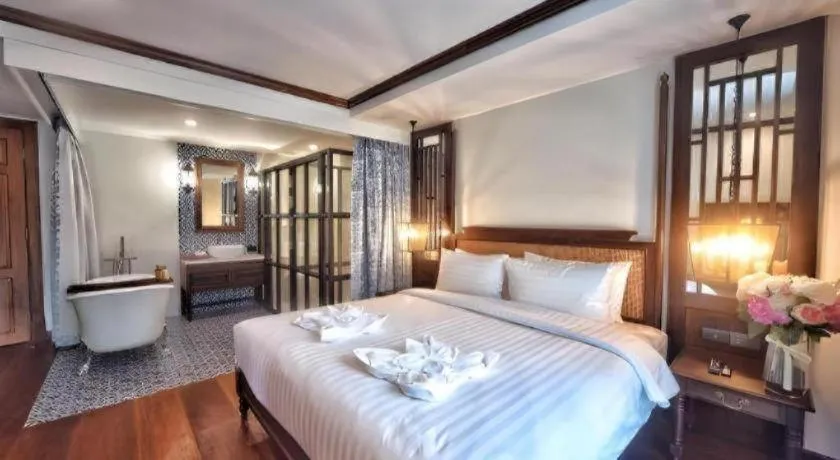 Bed in De Manor Chiang Mai Hotel