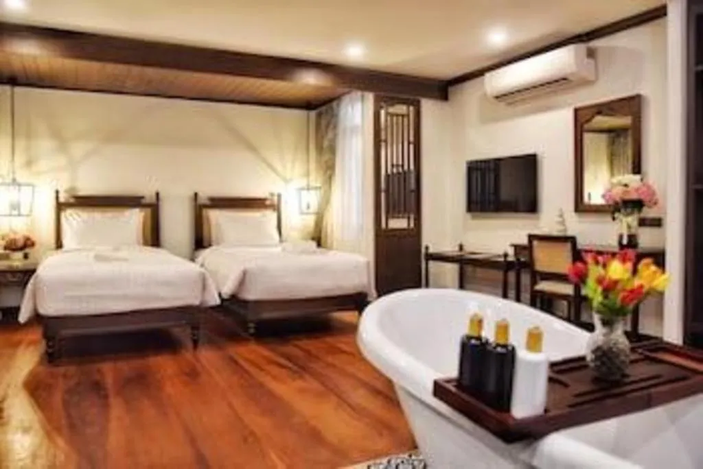 Bed in De Manor Chiang Mai Hotel