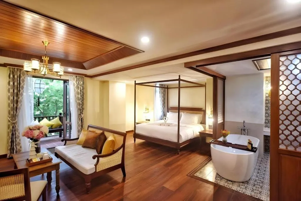 Bed in De Manor Chiang Mai Hotel