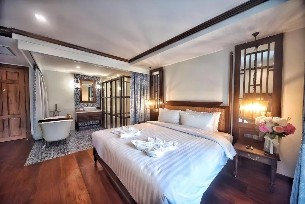 Bed in De Manor Chiang Mai Hotel