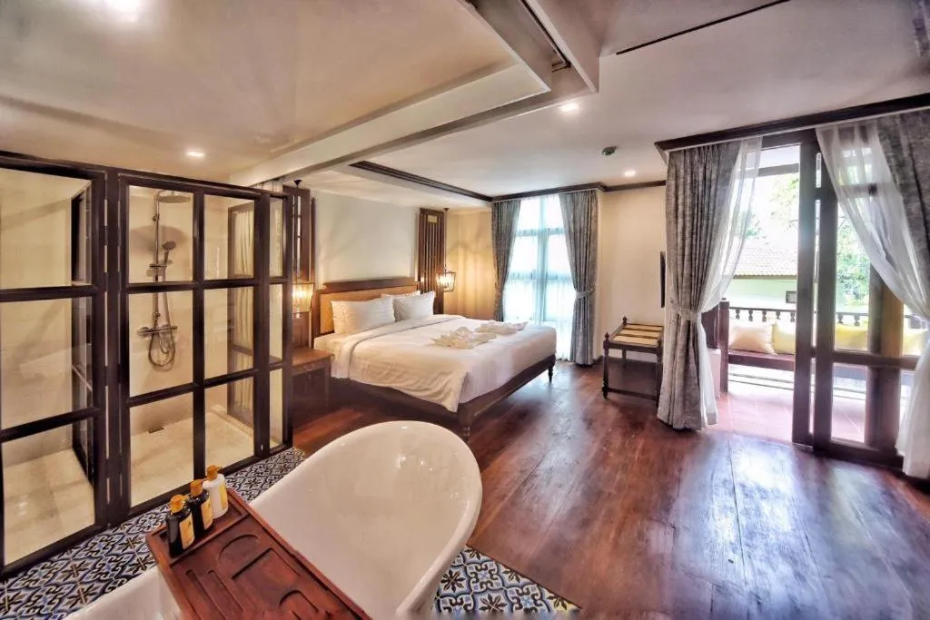 Bed in De Manor Chiang Mai Hotel