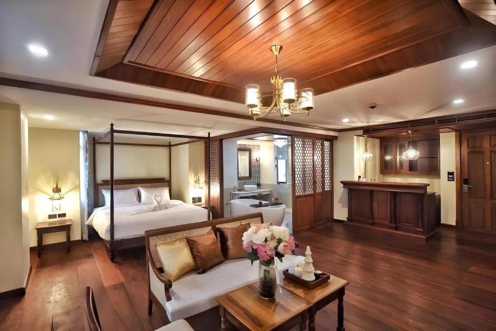 Bed in De Manor Chiang Mai Hotel