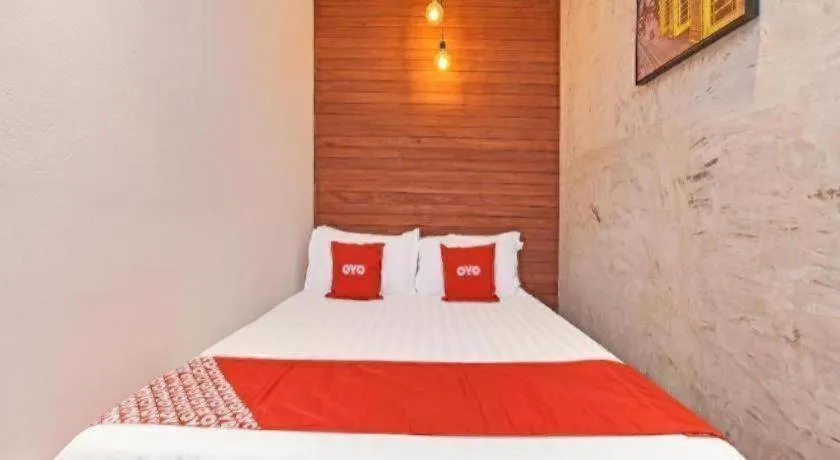 Bed in OYO 90662 The 1975 Hotel