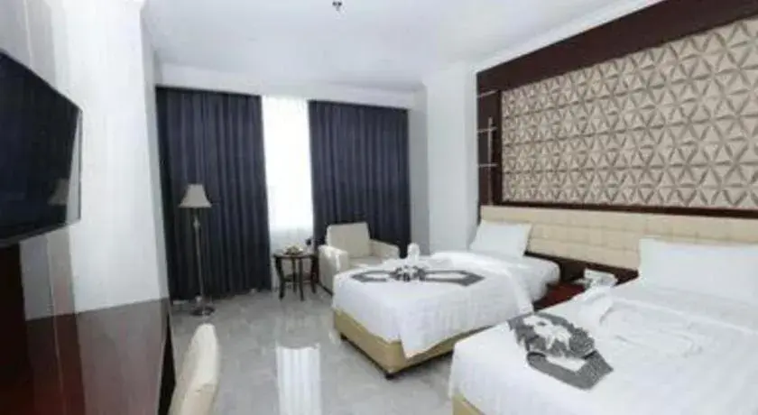 Bed in Sindoro Hotel Cilacap By Conary Bed in Sindoro Hotel Cilacap By Conary
