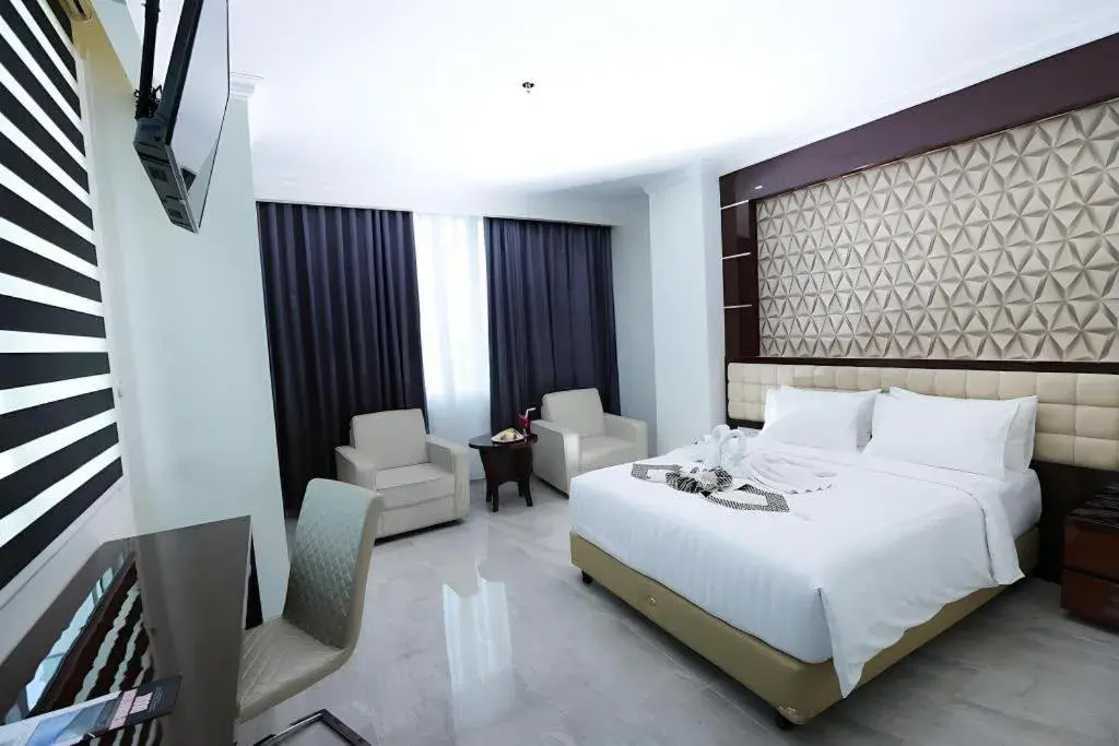 Bed in Sindoro Hotel Cilacap By Conary Bed in Sindoro Hotel Cilacap By Conary
