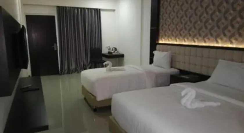 Bed in Sindoro Hotel Cilacap By Conary Bed in Sindoro Hotel Cilacap By Conary