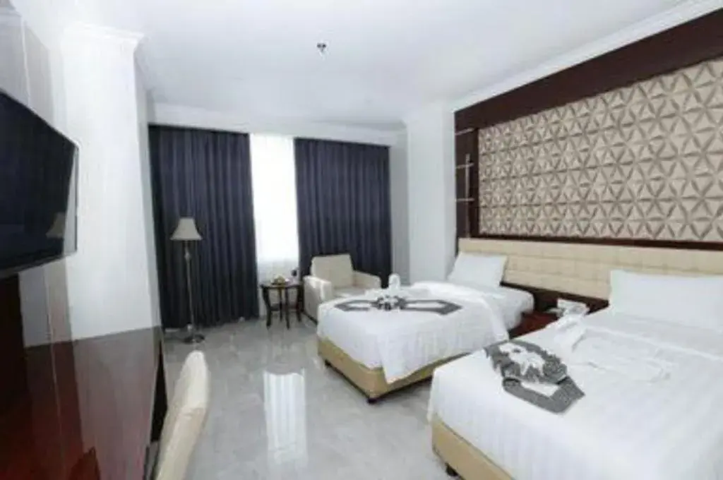 Bed in Sindoro Hotel Cilacap By Conary Bed in Sindoro Hotel Cilacap By Conary