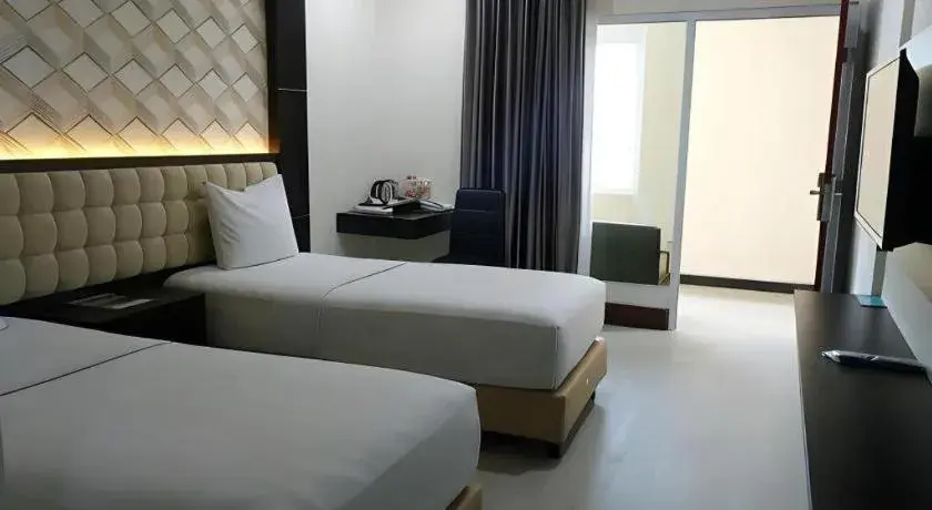 Bed in Sindoro Hotel Cilacap By Conary Bed in Sindoro Hotel Cilacap By Conary