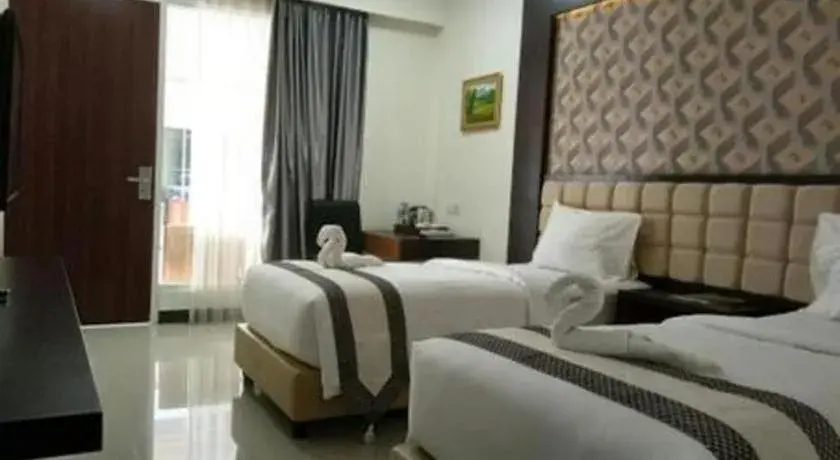 Bed in Sindoro Hotel Cilacap By Conary Bed in Sindoro Hotel Cilacap By Conary