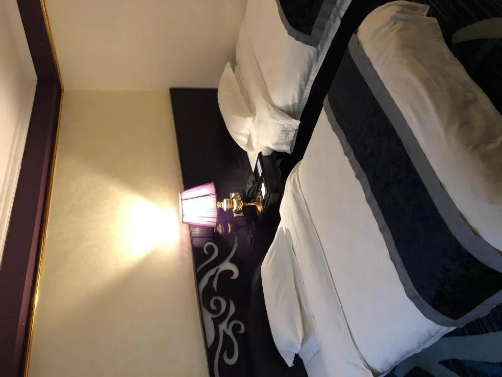 Bed in Guilin Sapphire hotel