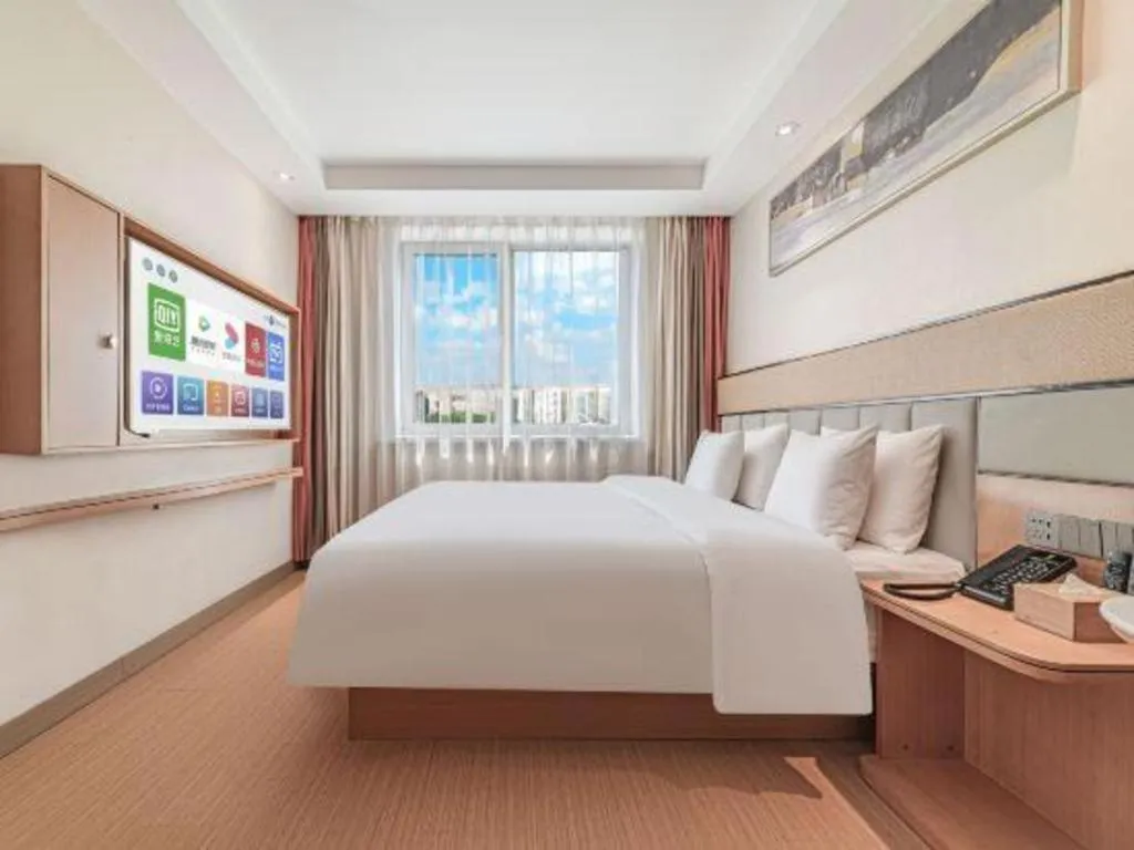 Bed in GreenTree Inn Geermu Walking Street Business Hotel