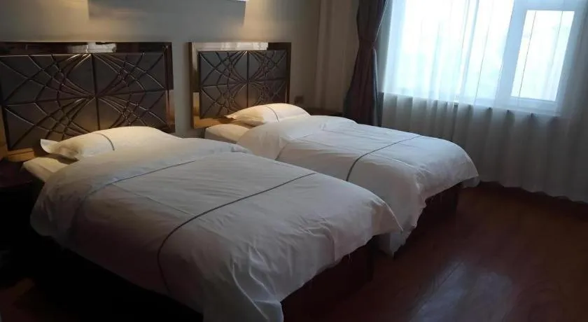 Bed in GreenTree Inn Geermu Walking Street Business Hotel