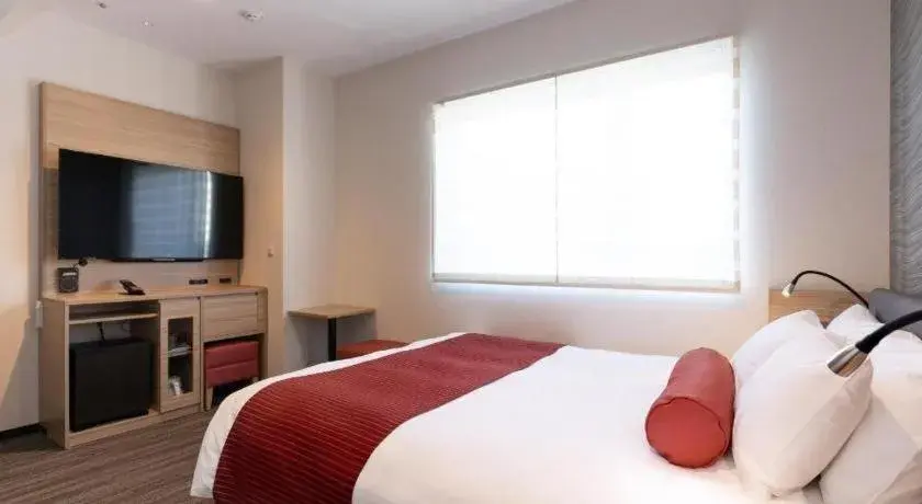 Bed in KEIKYU EX INN Hamamatsucho Daimon-Station (Tokyo) Bed in KEIKYU EX INN Hamamatsucho Daimon-Station (Tokyo)