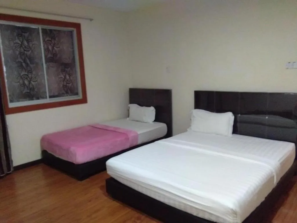 Bed in Hotel Sarina