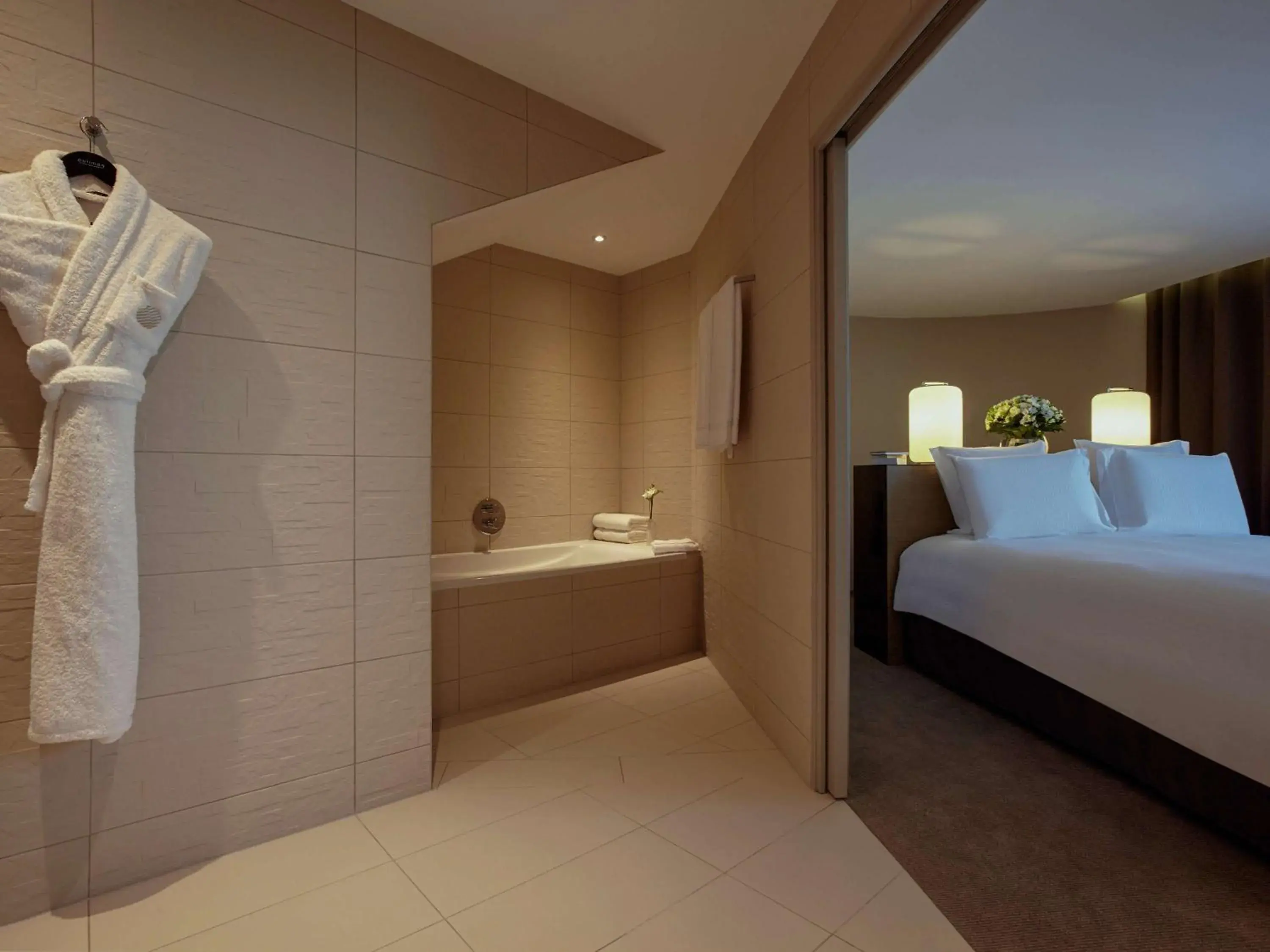 Bathroom, Bed in Pullman Paris Roissy Cdg Airport Bathroom, Bed in Pullman Paris Roissy Cdg Airport