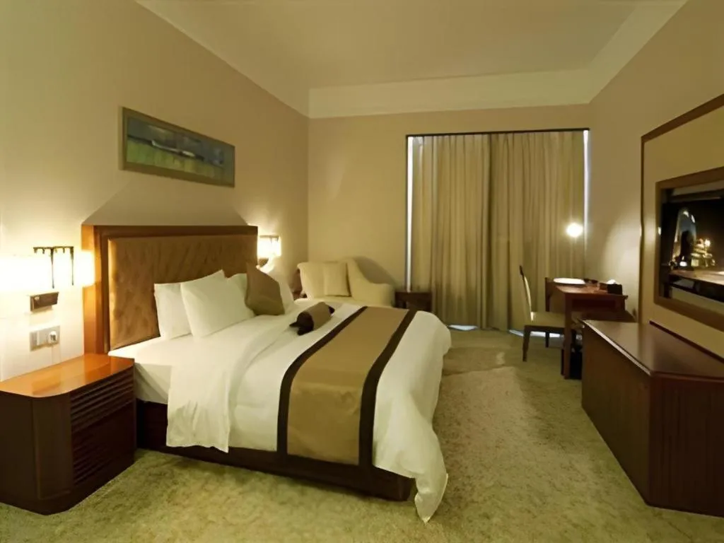 Bed in Yihao International Hotel