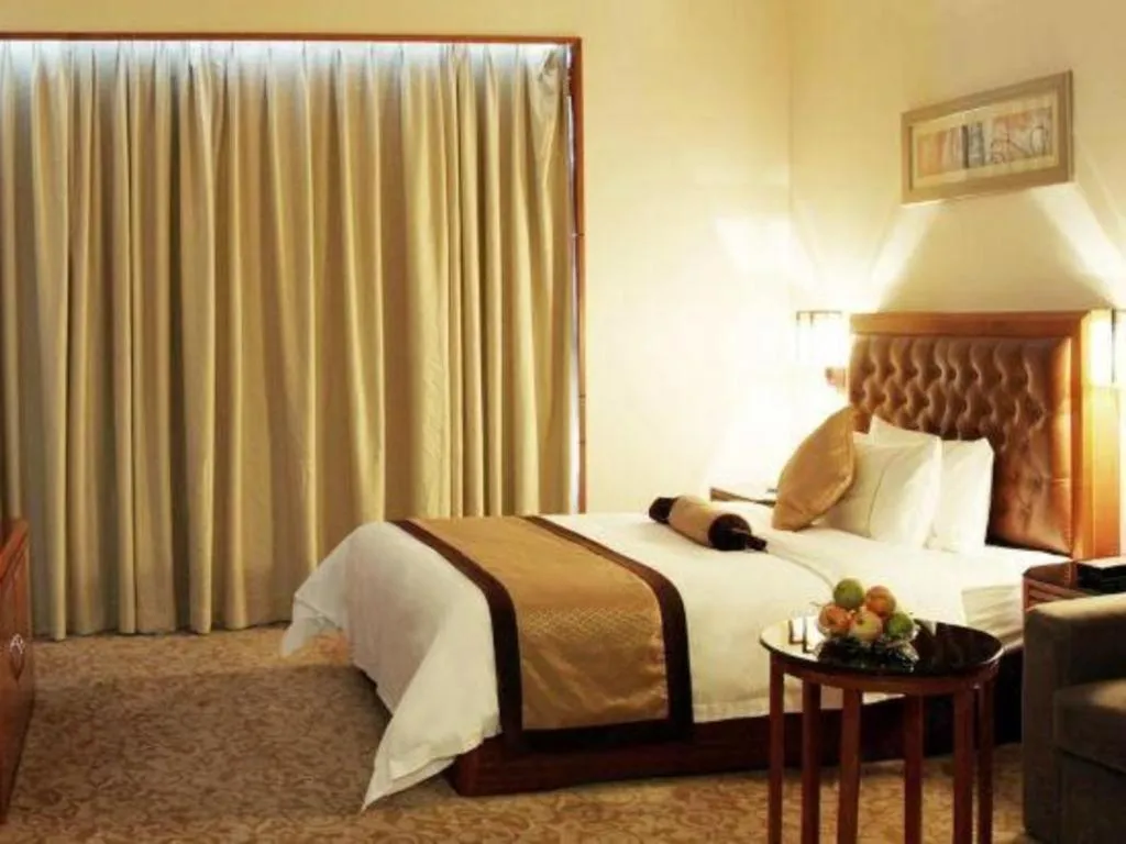 Bed in Yihao International Hotel