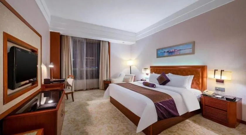 Bed in Yihao International Hotel