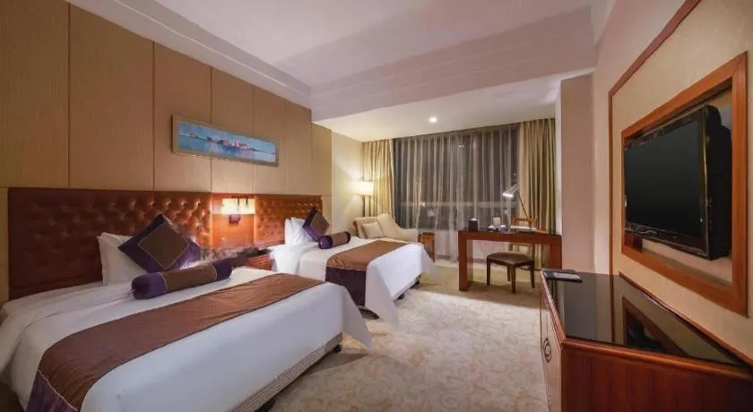 Bed in Yihao International Hotel