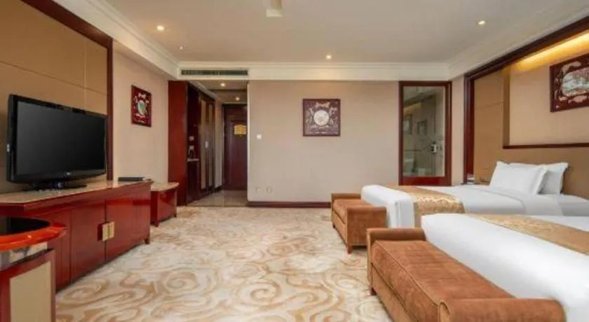 Bed in Chutian Guangdong International Hotel