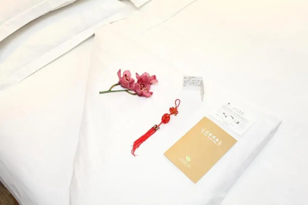 Bed in Chutian Guangdong International Hotel Bed in Chutian Guangdong International Hotel