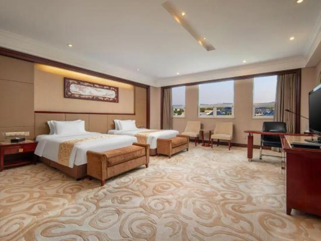 Bed in Chutian Guangdong International Hotel