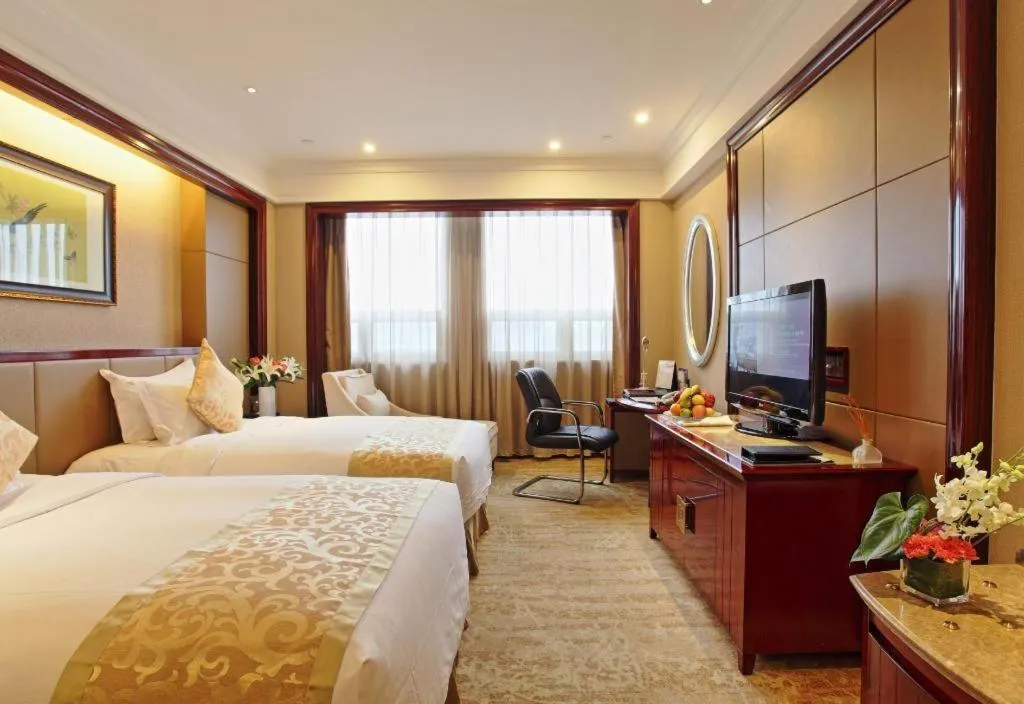 Bed in Chutian Guangdong International Hotel