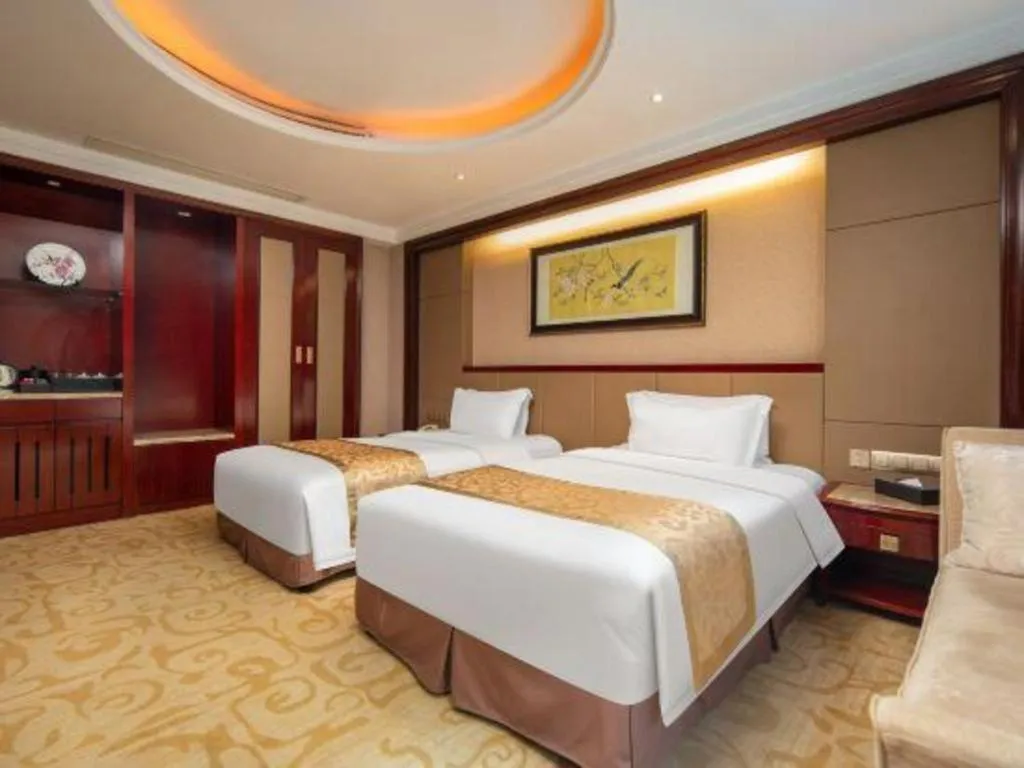 Bed in Chutian Guangdong International Hotel