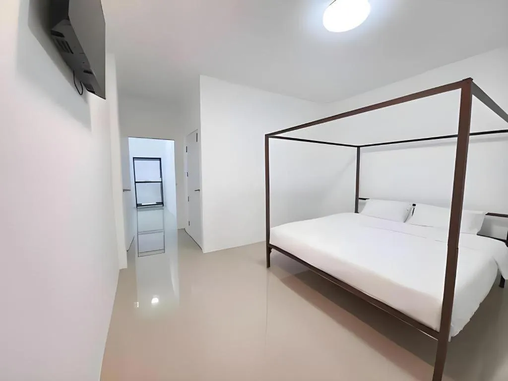 Bed in WICKET WHITE VILLA