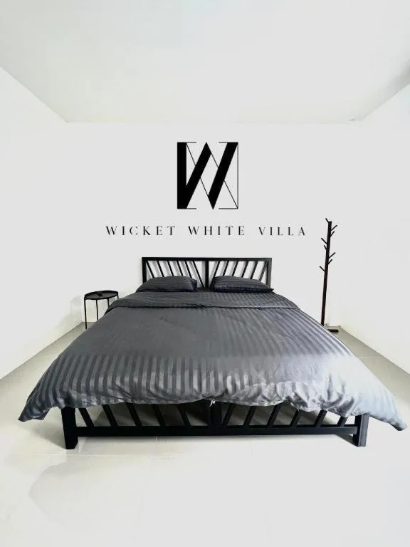 Bed in WICKET WHITE VILLA