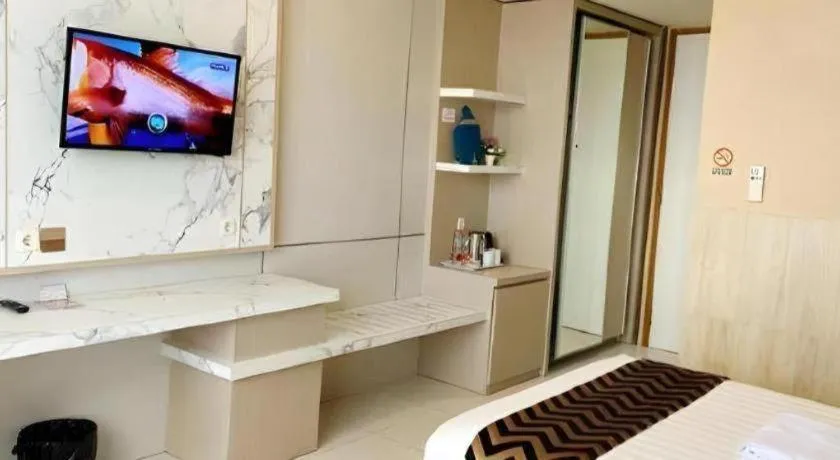 Bed in Sumbawa Grand Hotel