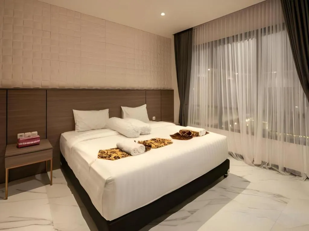 Bed in Sumbawa Grand Hotel