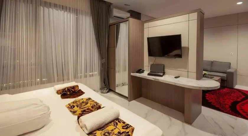 Bed in Sumbawa Grand Hotel