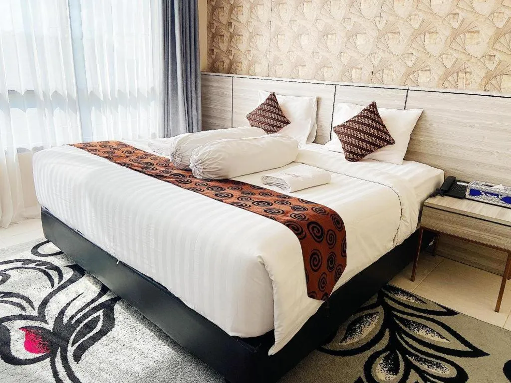 Bed in Sumbawa Grand Hotel