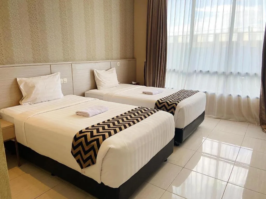 Bed in Sumbawa Grand Hotel