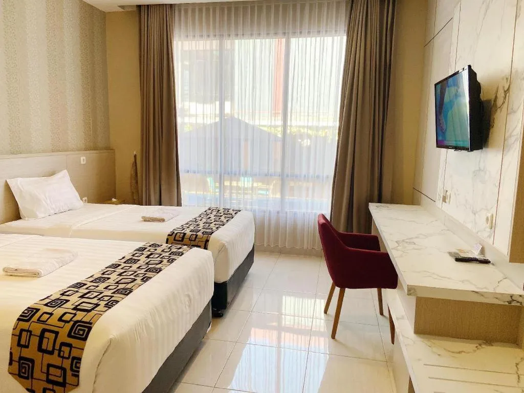 Bed in Sumbawa Grand Hotel