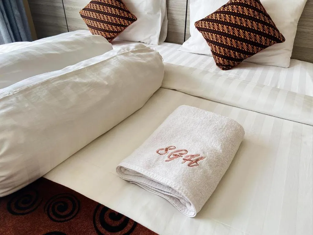 Bed in Sumbawa Grand Hotel