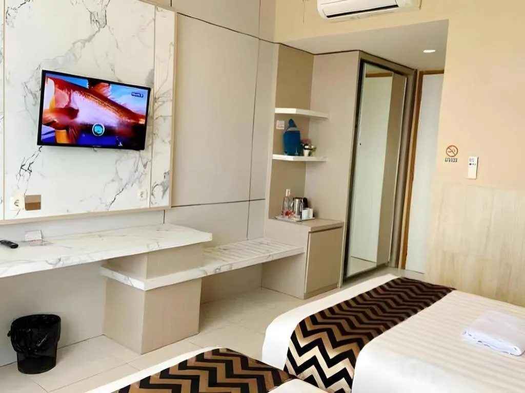 Bed in Sumbawa Grand Hotel